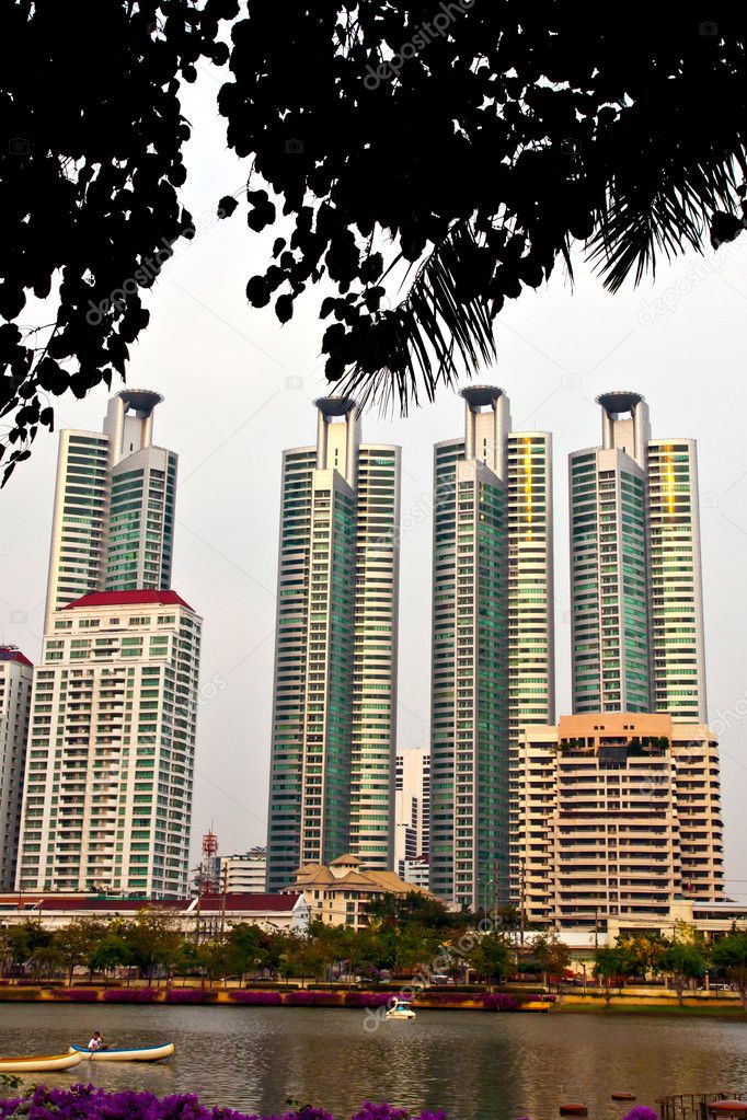 High rise white tall buildings and lake