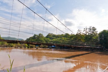 Wooden suspension bridge from side clipart