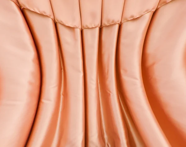 Krzywa pomarańczowym tkaniny kurtyna — Zdjęcie stockowe