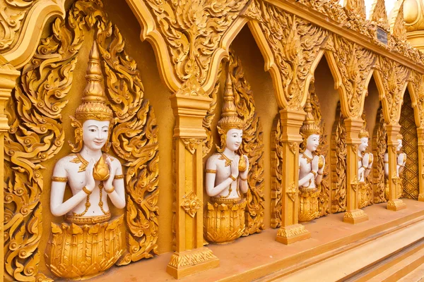 Angel wall of buddhist temple tilted out overall — Stock Photo, Image