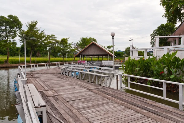 stock image Wooden bridge to hut tilted