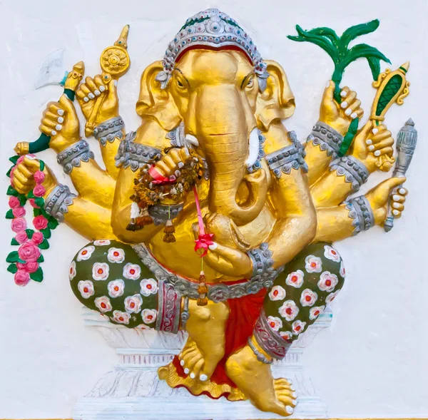 Goldene Sechs-Hände-Ganesha an weißer Wand — Stockfoto