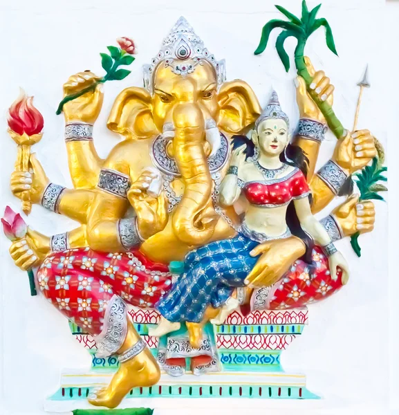 Sitting golden eight hands ganesha with angel — Stock Photo, Image