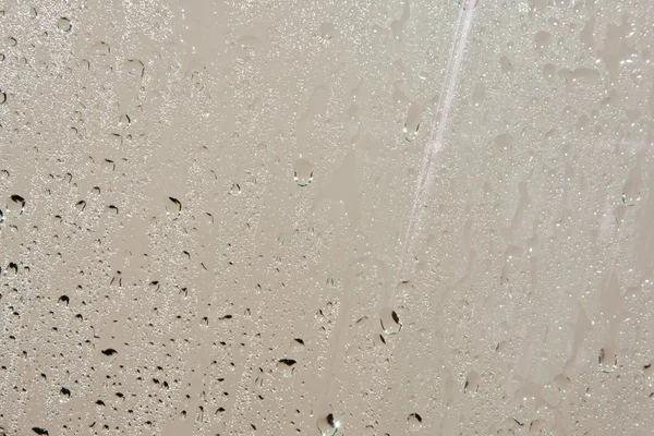 Gota de chuva em vidro em linha — Fotografia de Stock