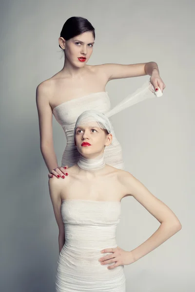 Two girls in bandages — Stock Photo, Image