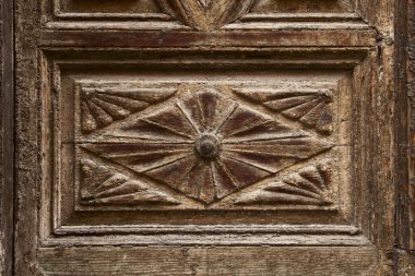 Old ornamental design in wood, wooden carved door detail clipart