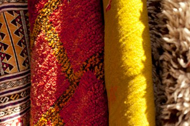 Moroccan Carpets in a street shop souk clipart