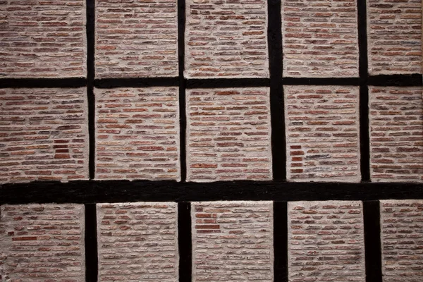 Old historic beamed house brick wall in spain — Stock Photo, Image