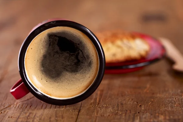 Extremely overturned espresso coffee in red enamel mug — Stock Photo, Image
