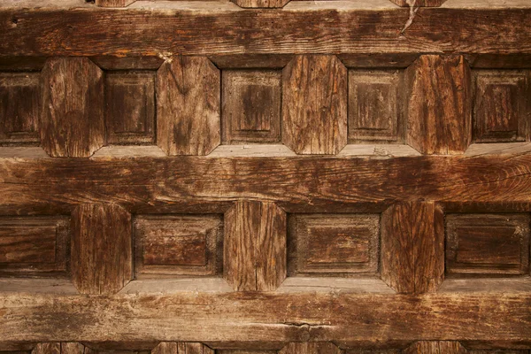 Old ornamental design in wood, wooden carved door detail — Stock Photo, Image