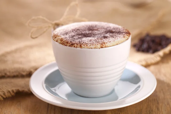 Hot frothy drink cappuccino coffee, rustic style, shallow dof — Stock Photo, Image