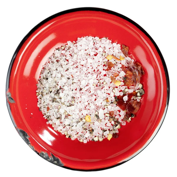 stock image Seasoned sea salt in enamel red plate, isolated