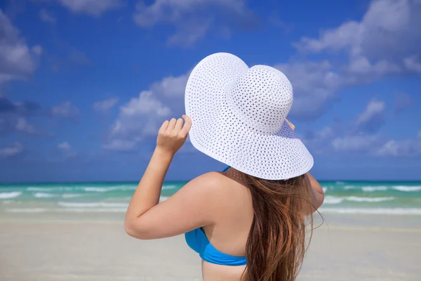 stock image Girl with white sun hat and carribean sea