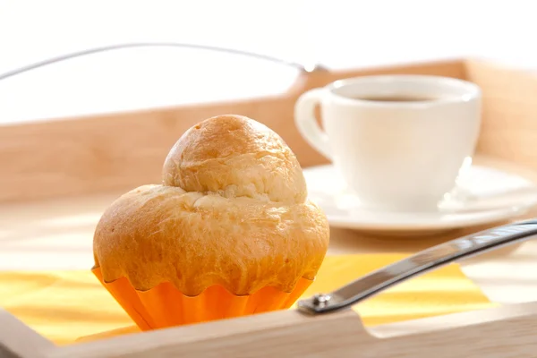 stock image French Brioche and white cup of Coffee on background