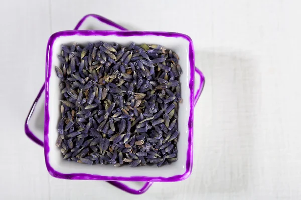 Dried Lavender flowers in square plates on whitewood, shallow do — Stock Photo, Image