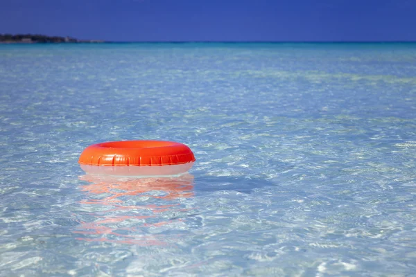 Floating ring on blue clear sea — Stock Photo, Image