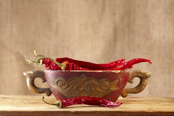Red hot chillies pepper in old wooden bowl — Stock Photo, Image