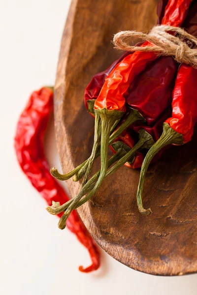 Red hot chillies pepper bunch in wooden bowl — Stock Photo, Image