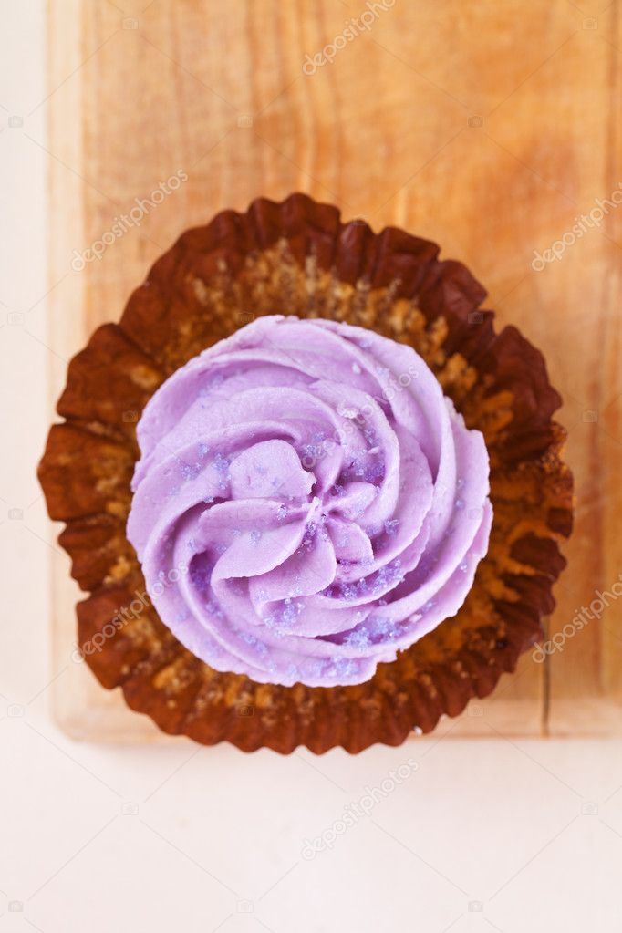 Cupcake with lavender top unwrapped