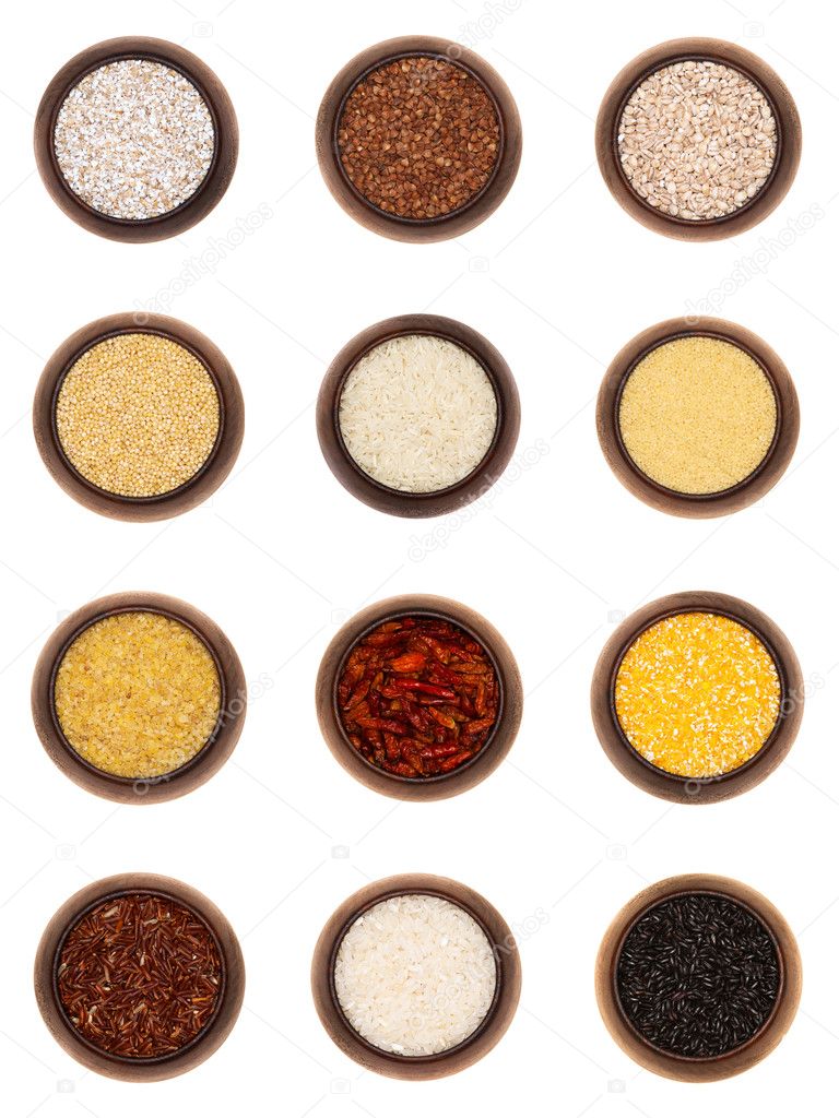 Twelve different cereals in wooden bowls, isolated