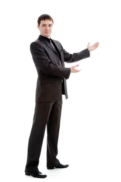 Egy fiatal férfi egy öltöny gesztusok a kezével. — Stock Fotó
