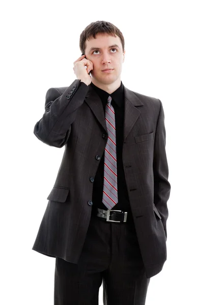 Egy fiatal férfi öltöny, beszél a telefonon. — Stock Fotó