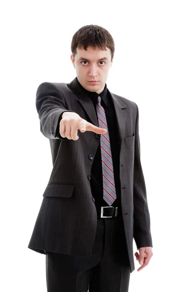 Νεαρός άνδρας σε ένα κοστούμι, βαθμοί το δάχτυλό του. — Φωτογραφία Αρχείου