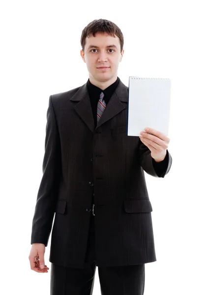 Young man in a suit shows a notebook. — Stock Photo, Image