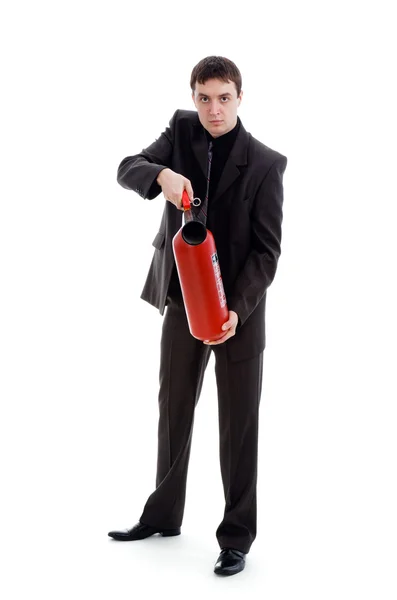 Mladý muž v obleku drží hasicí. — Stock fotografie