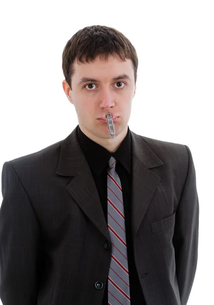 Young man in a suit, a pin with your mouth closed. — Stock Photo, Image
