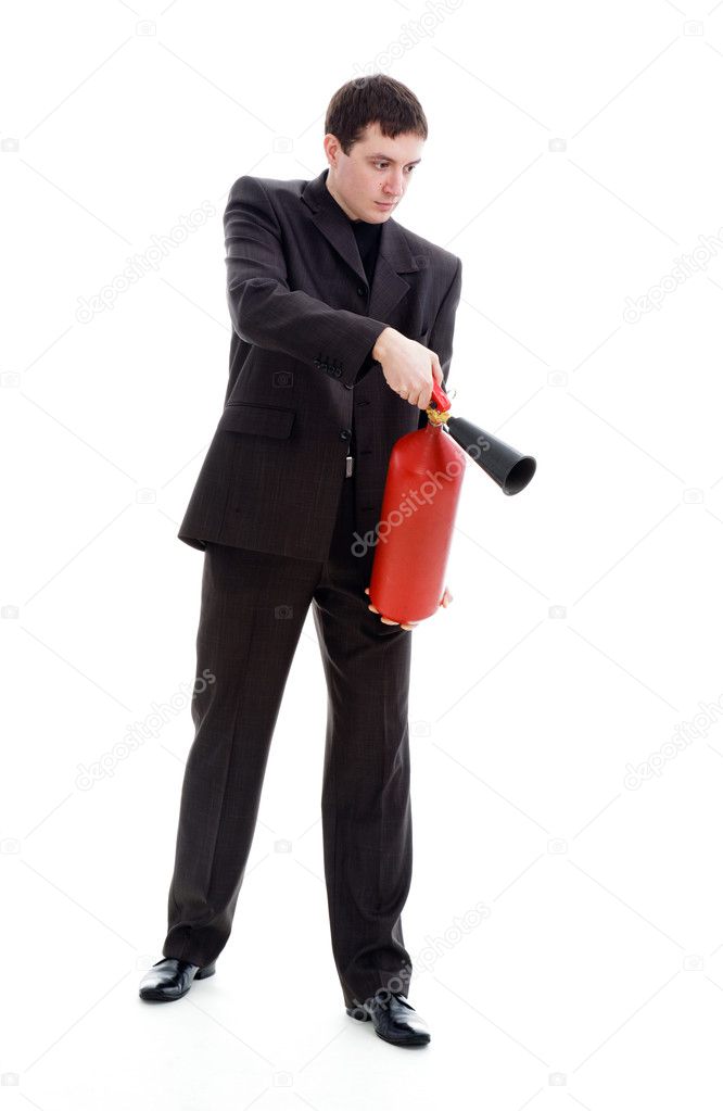 Young man in a suit holding a fire extinguisher.