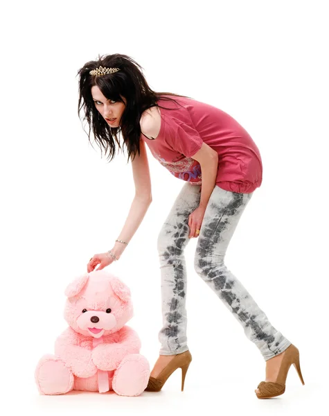 Sexy young girl takes the pink teddy bear, isolated white background. — Stock Photo, Image