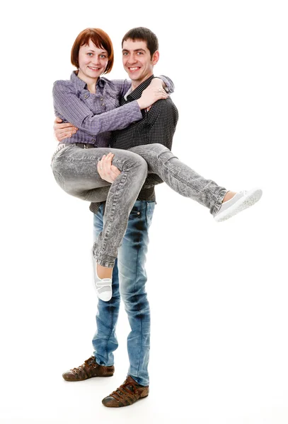 Young male is holding girl. — Stock Photo, Image