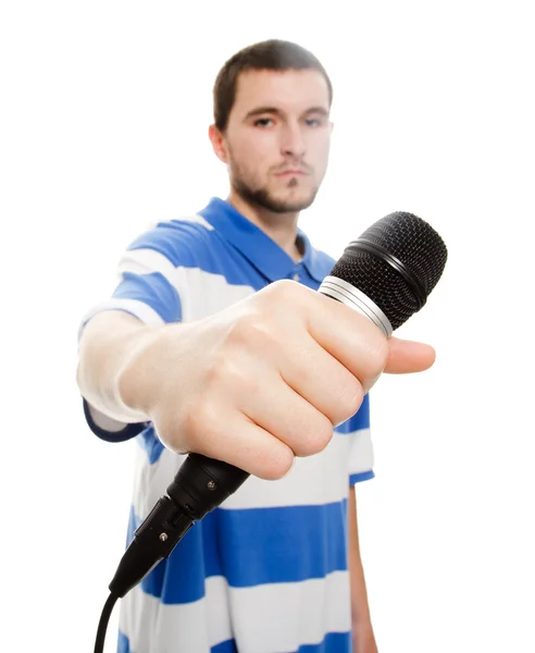 Ένας νεαρός άντρας με ένα μικρόφωνο. — Φωτογραφία Αρχείου