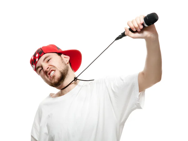 A young guy with a beard strangles himself microphone. — Stock Photo, Image