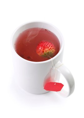 yakın çekim ile çilek meyve çay, çay poşeti vurdu.