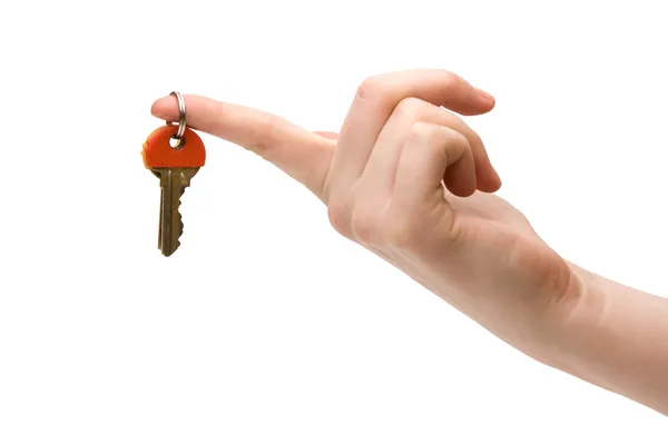 Ключи держат указательный палец. — стоковое фото