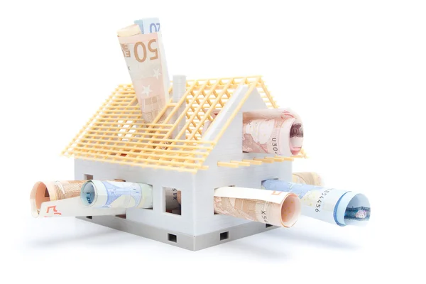 Dinheiro e casa — Fotografia de Stock