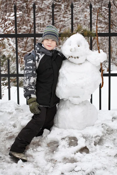 stock image Boy and snowman