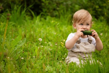 Baby and cucumbers clipart