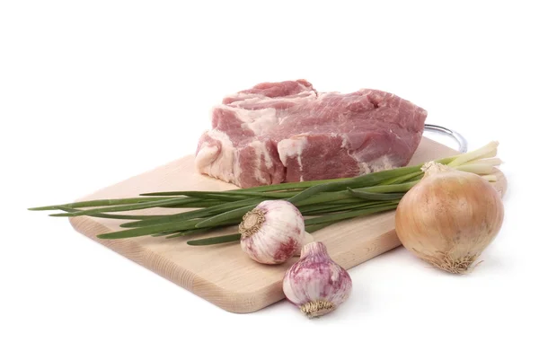 Raw meat with onion and garlic isolated on white — Stock Photo, Image