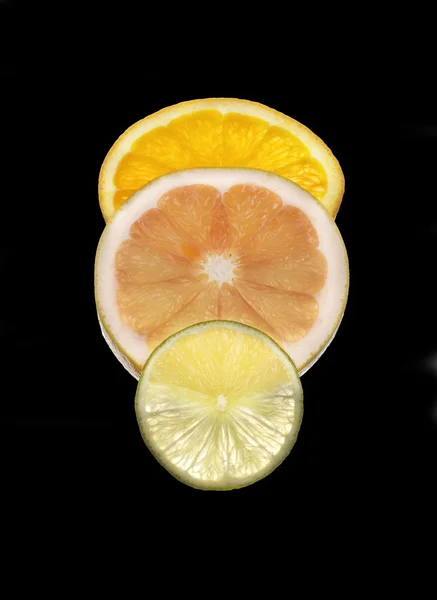 Plátky pomeranče, limetky a grapefruity — Stock fotografie