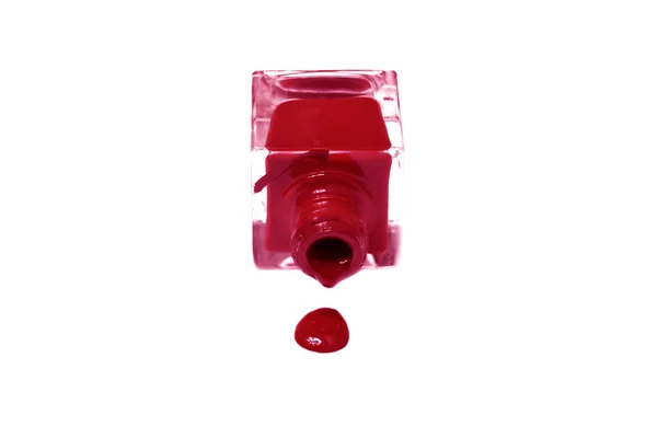 Red nail polish bottle with splatters isolated on white backgrou — Stock Photo, Image