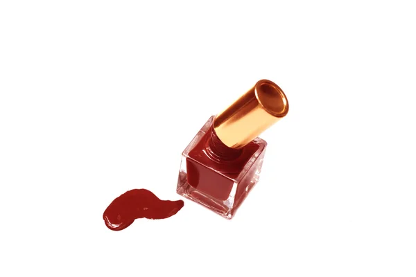 Röda nagellack flaska med stänker — Stockfoto