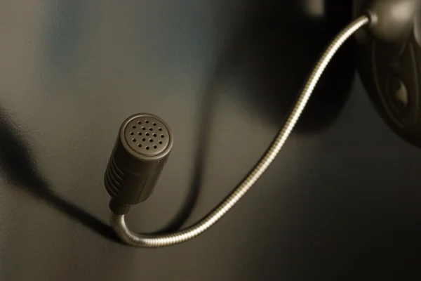 stock image Macro of microphone on gray backgound