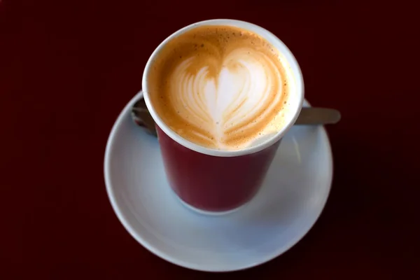 Cup of cofee with drawing heart on scream (macro) — Stock Photo, Image