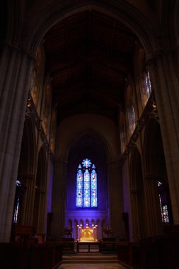 Church, interior, light from stained-glass window clipart