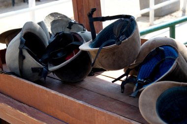 Helmets on table. clipart