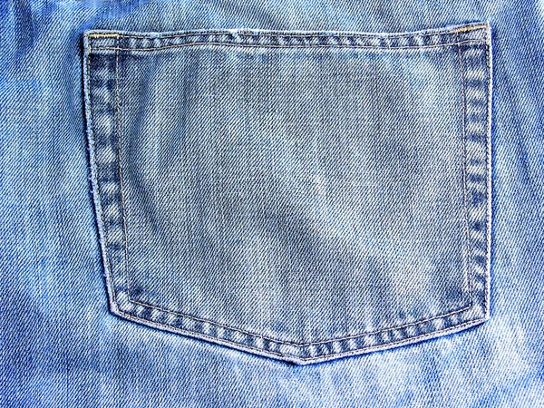 Blauwe katoenen jeans met een zak, als achtergrond — Stockfoto
