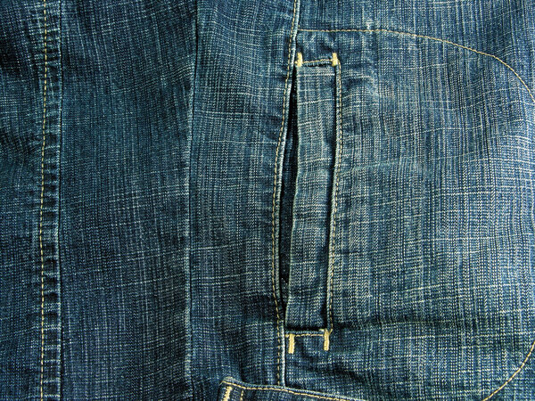 Blue cotton jeans with a pocket, as a background